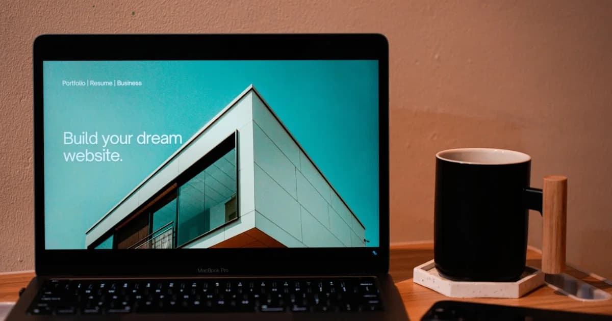 a laptop computer sitting on top of a wooden desk