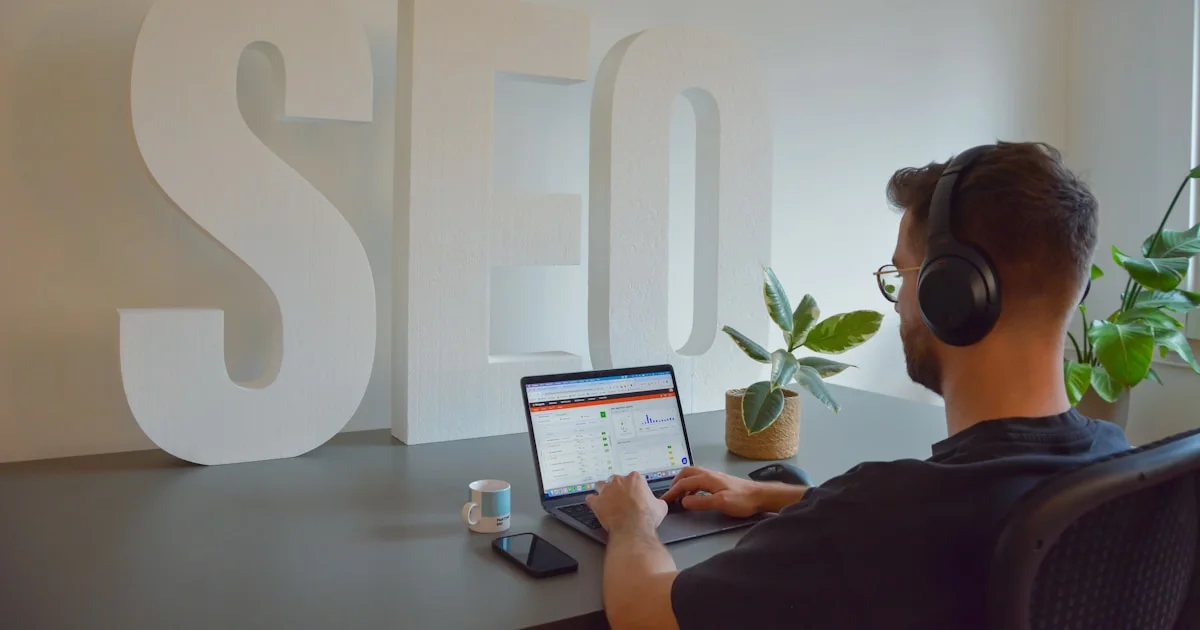 a man sitting in front of a laptop computer