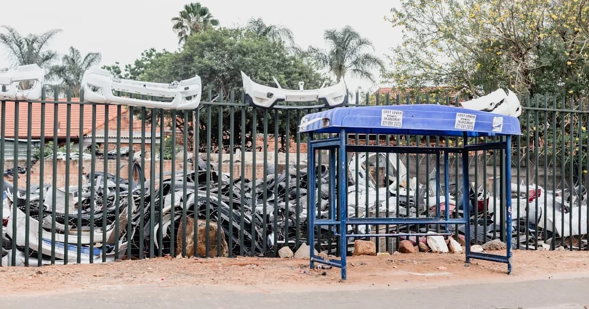 a bunch of bikes that are behind a fence
