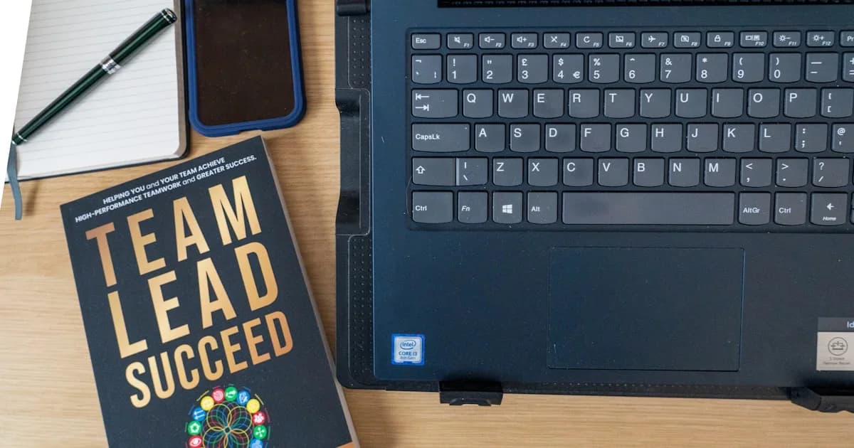 a book and a laptop on a table