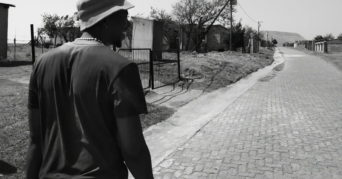 a man is walking down a brick road