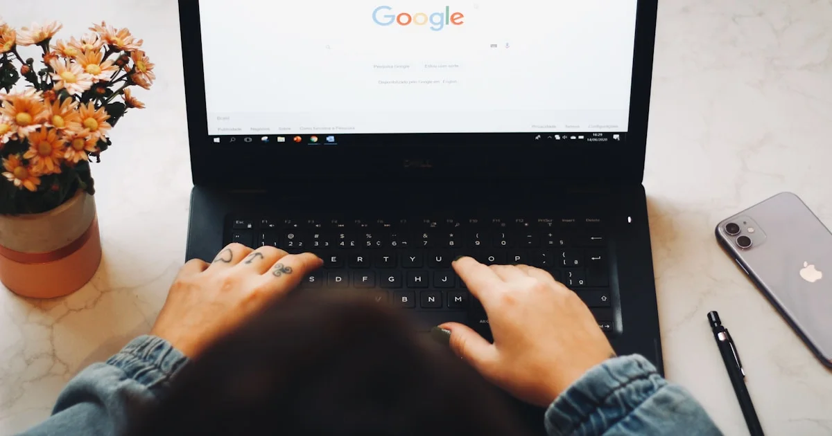 person using black laptop computer