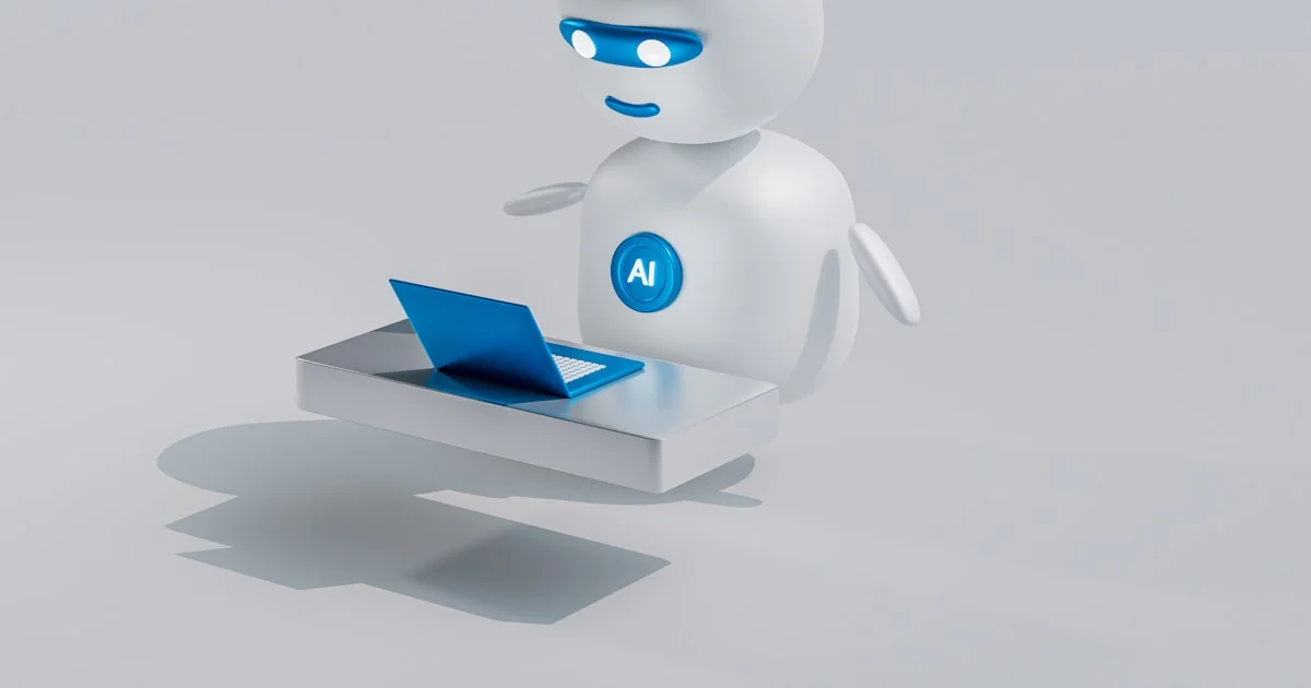 a white robot with blue eyes and a laptop