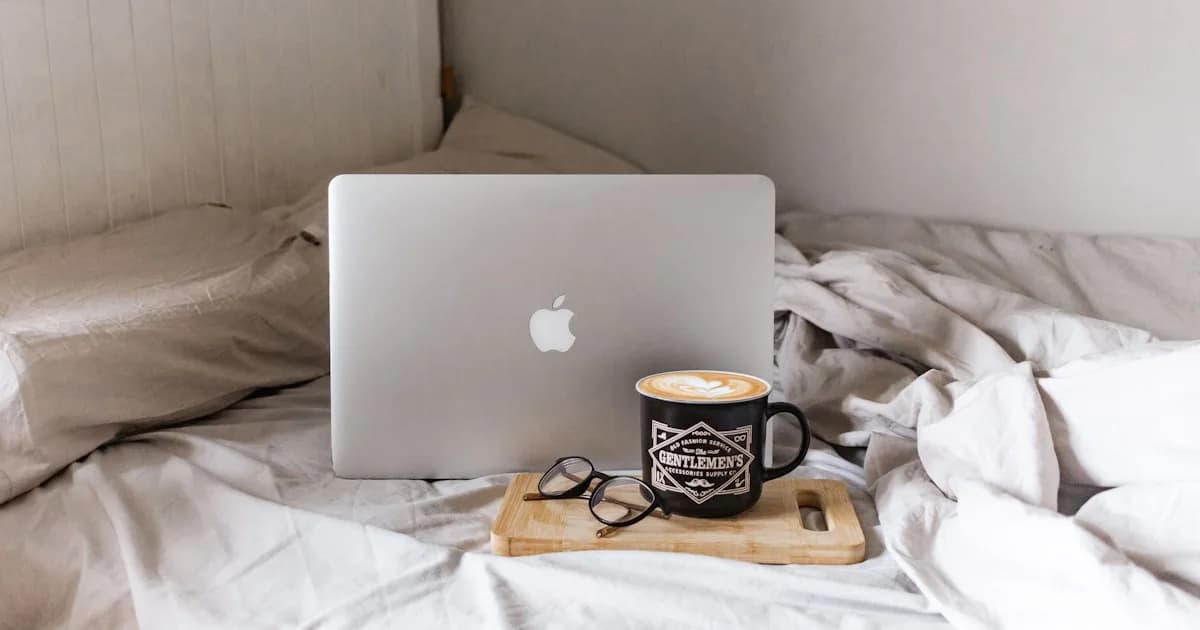 macbook air on brown wooden table