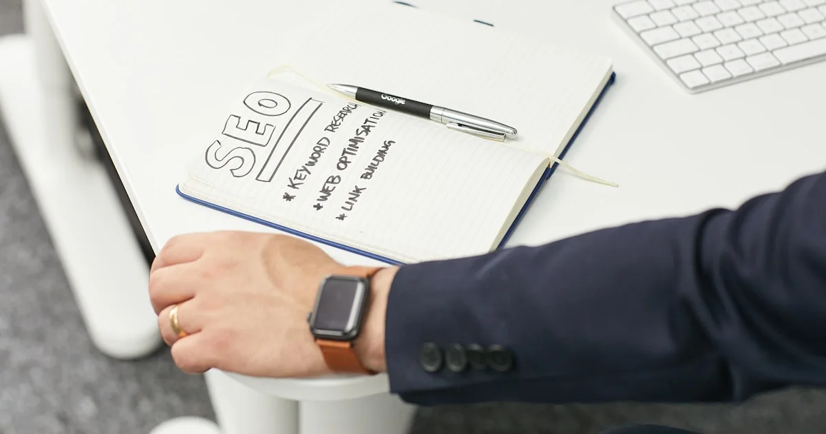 a person writing on a piece of paper