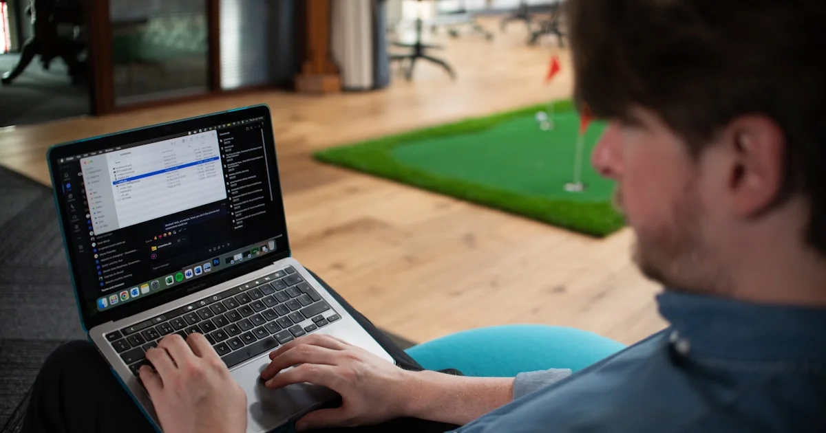 Man working on a laptop in an office