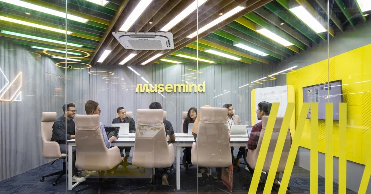 a group of people sitting around a table
