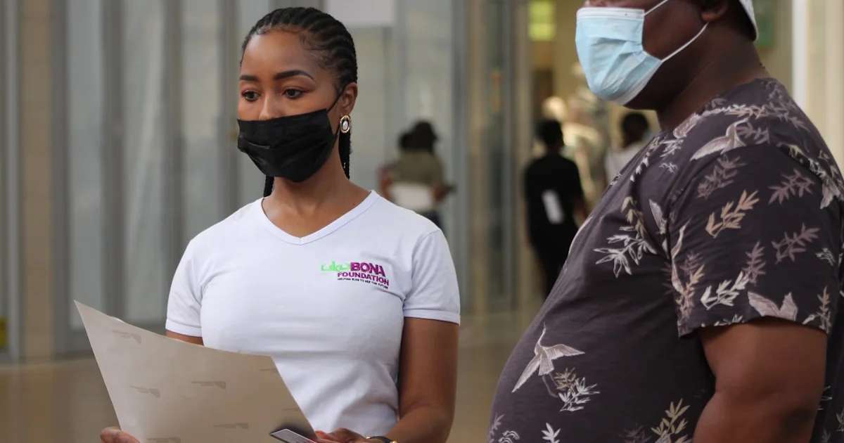 a man and a woman wearing face masks
