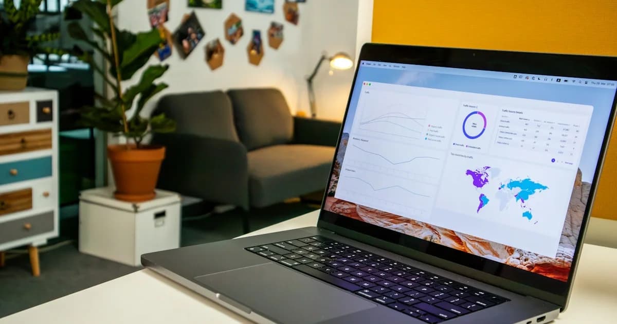 a laptop computer sitting on top of a white table