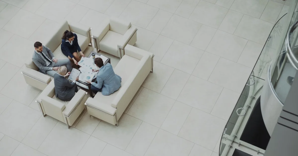 Business meeting around a table on sofas.