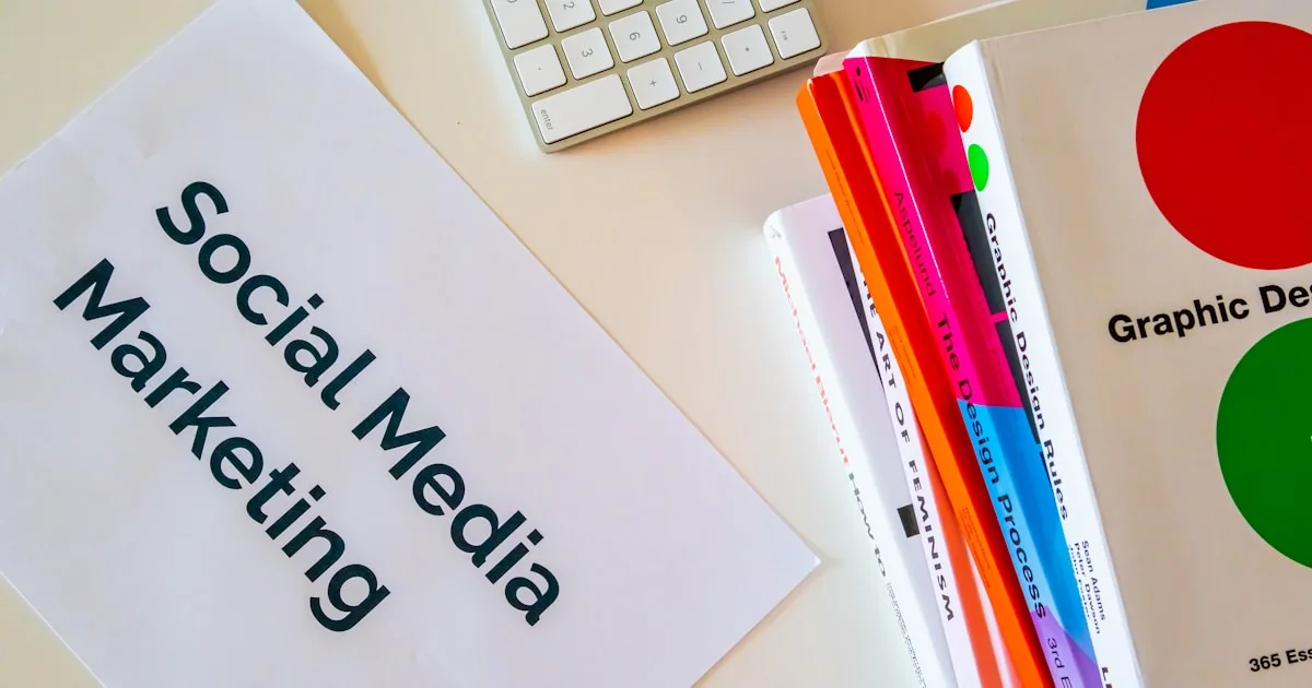 a sign that says social media marketing next to a keyboard