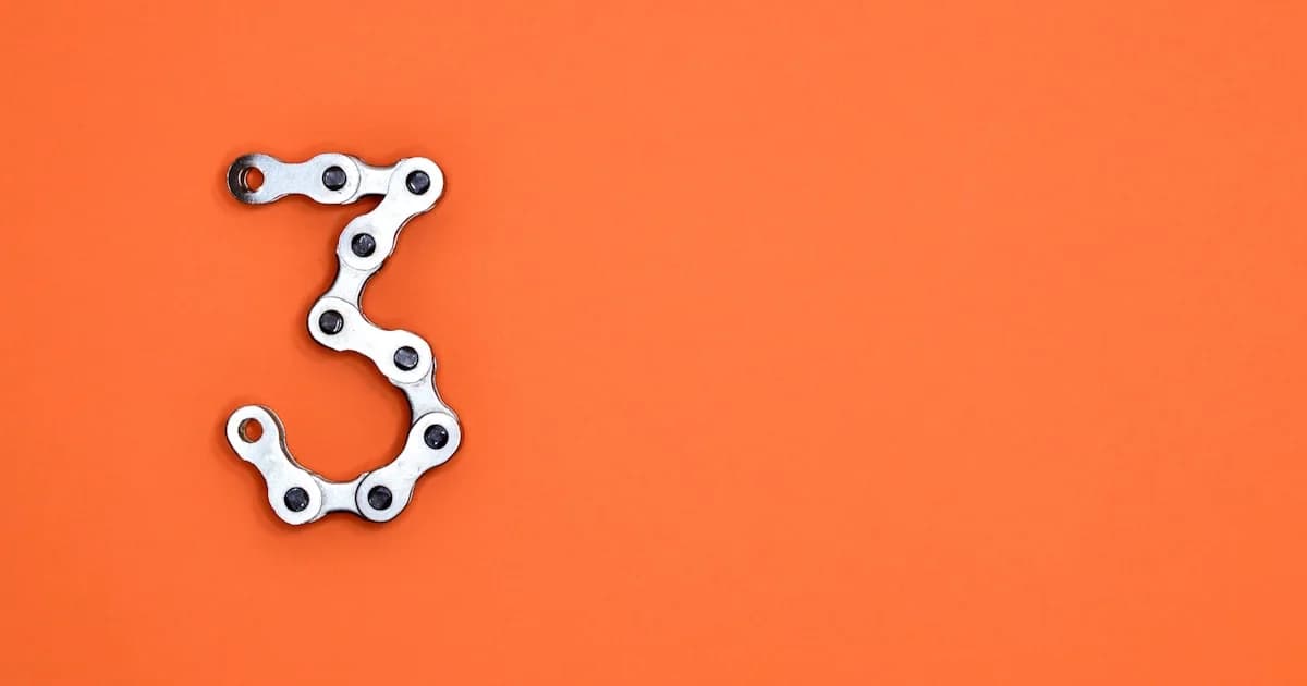 The number three is made of a bicycle chain.
