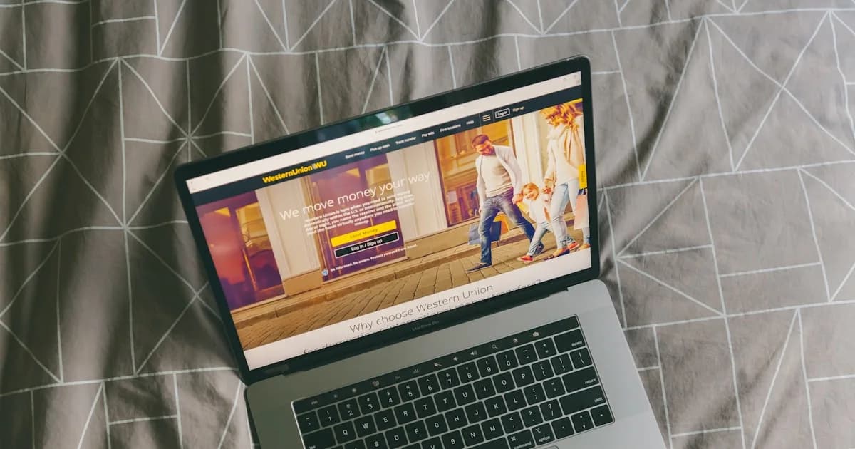 macbook pro on gray textile
