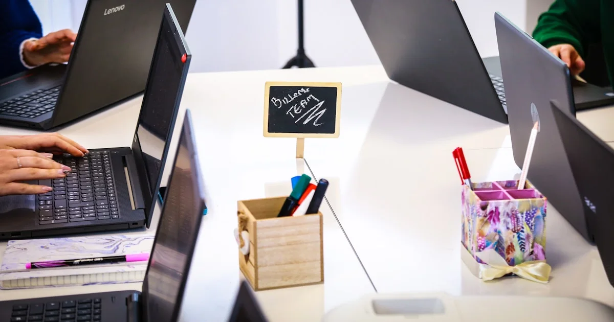 black laptop computer on white table