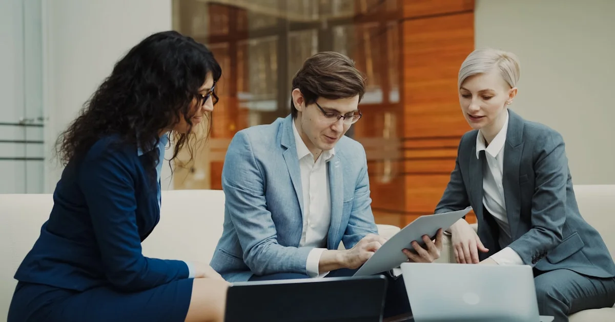Three business people collaborating on a project