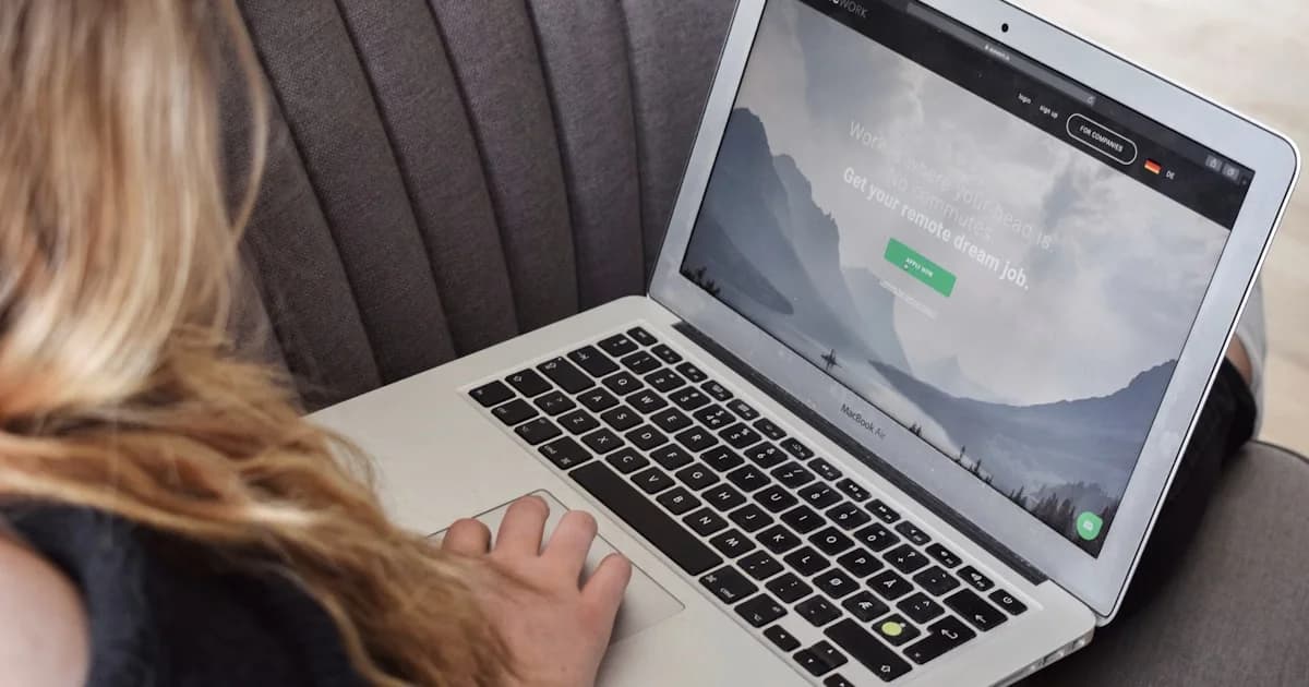 macbook air on persons lap