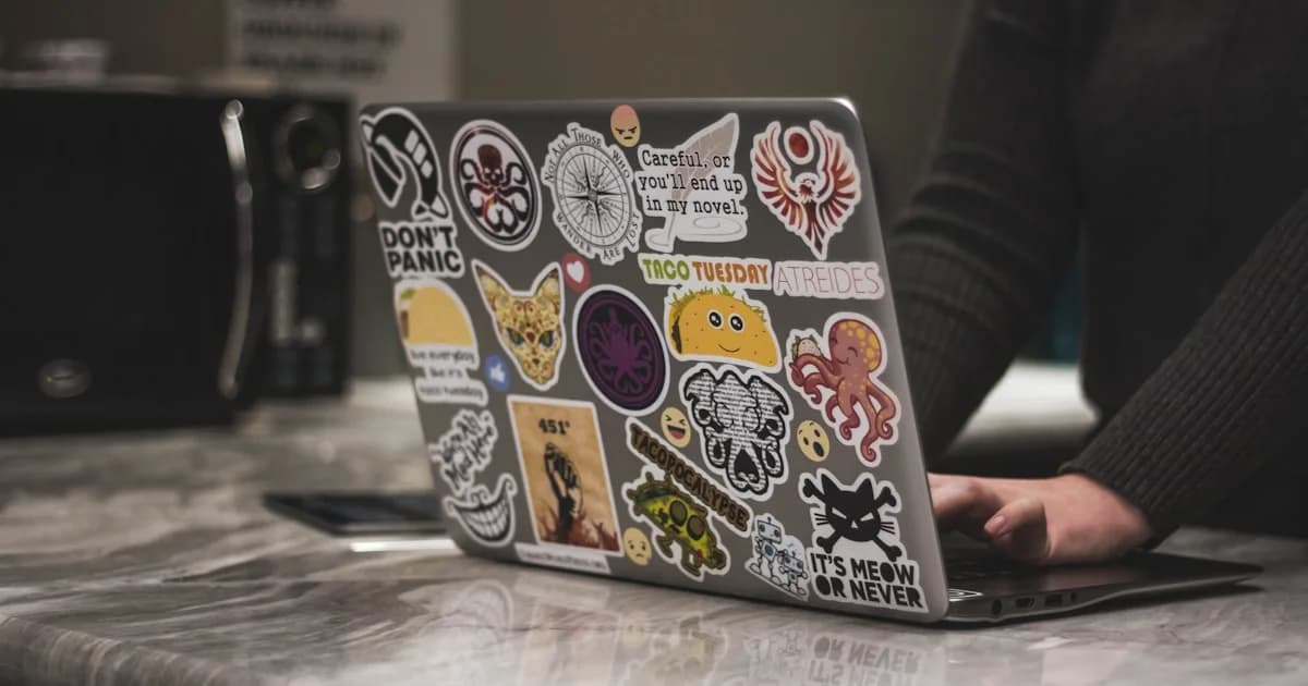 person surfing black laptop near microwave oven