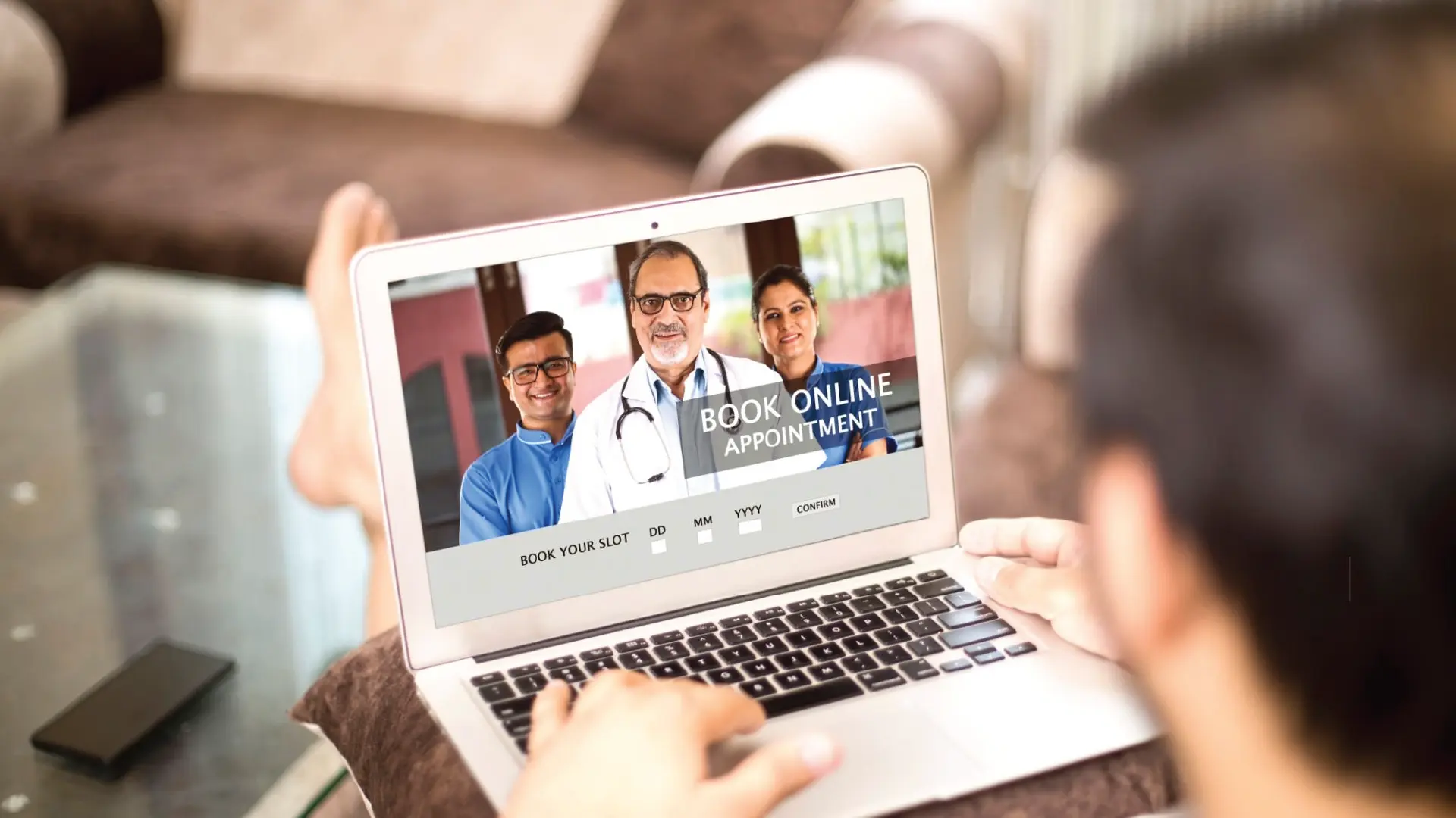 Picture of a man booking an online appointment using his computer